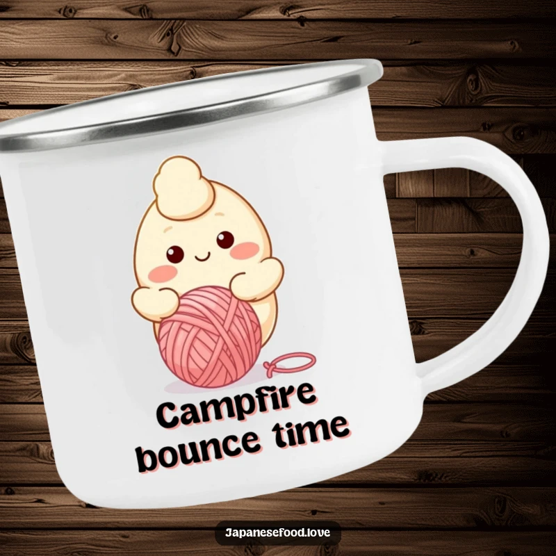 Funny camping mug showing a smiling dumpling character happily bouncing a yarn ball, ready for outdoor relaxation and fun.