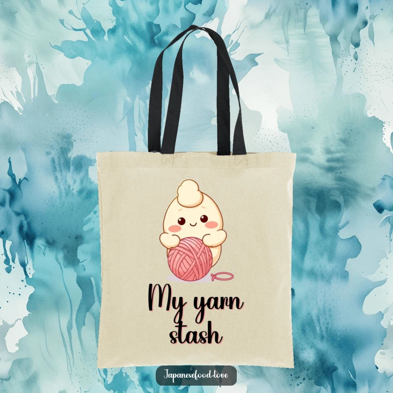 Funny tote bag with a cartoon dumpling character smiling while bouncing a ball of yarn, perfect for carrying essentials.